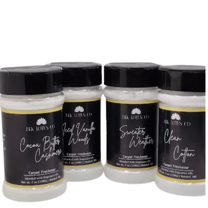 4 bottles of carpet freshener with a white background